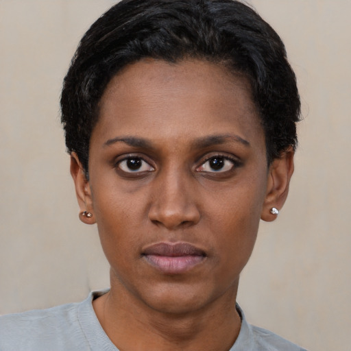 Neutral black young-adult female with short  black hair and brown eyes