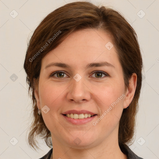 Joyful white young-adult female with medium  brown hair and green eyes