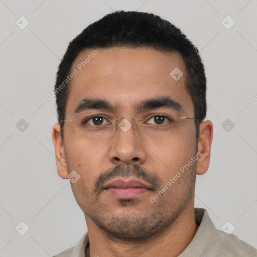 Neutral latino young-adult male with short  black hair and brown eyes