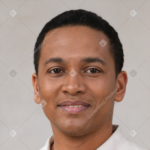 Joyful black young-adult male with short  black hair and brown eyes