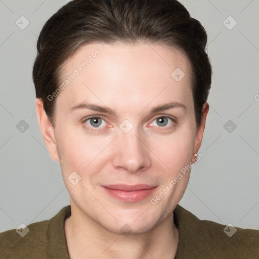 Joyful white young-adult female with short  brown hair and grey eyes