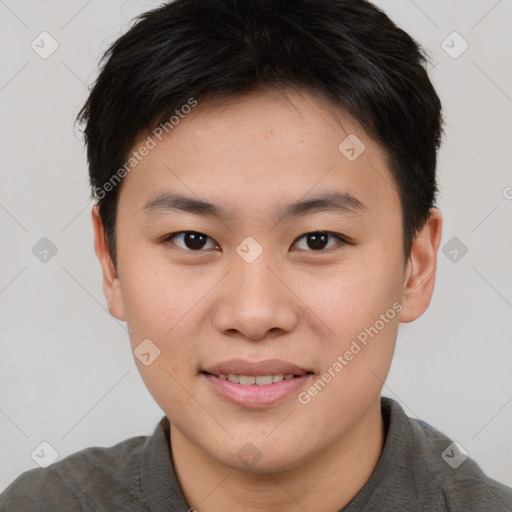 Joyful asian young-adult male with short  brown hair and brown eyes