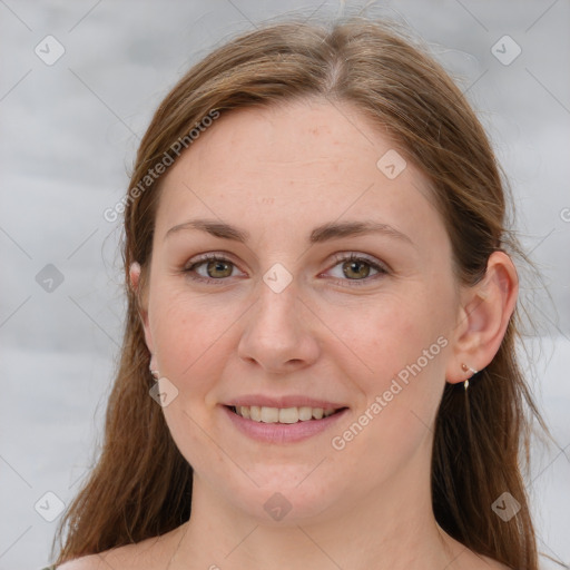 Joyful white young-adult female with long  brown hair and grey eyes