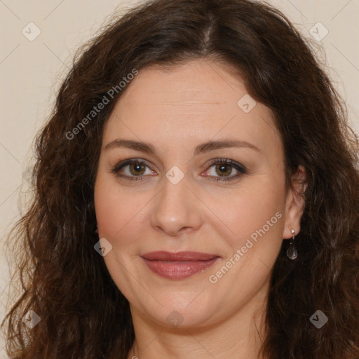 Joyful white adult female with long  brown hair and brown eyes