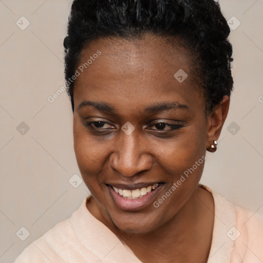 Joyful black young-adult female with short  brown hair and brown eyes