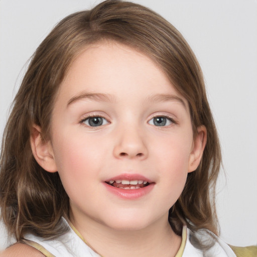 Joyful white child female with medium  brown hair and blue eyes