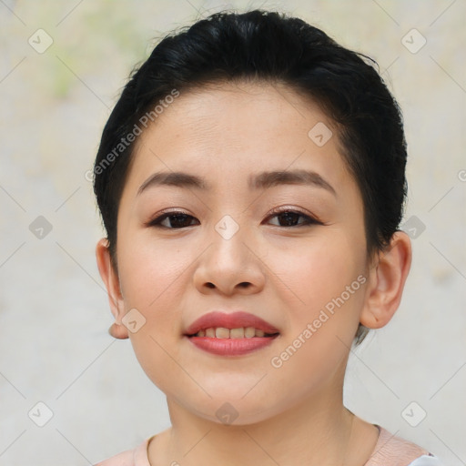 Joyful asian young-adult female with short  brown hair and brown eyes