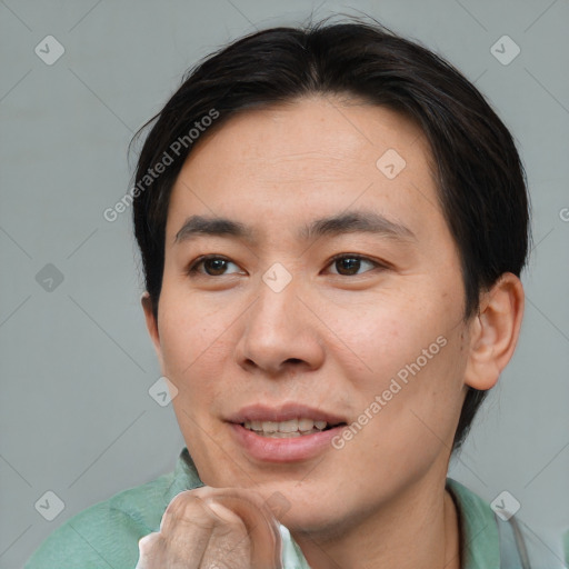 Joyful asian young-adult male with short  brown hair and brown eyes