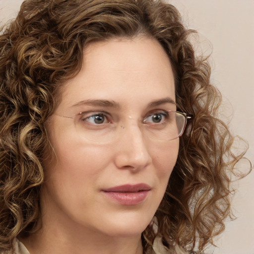 Joyful white young-adult female with medium  brown hair and green eyes