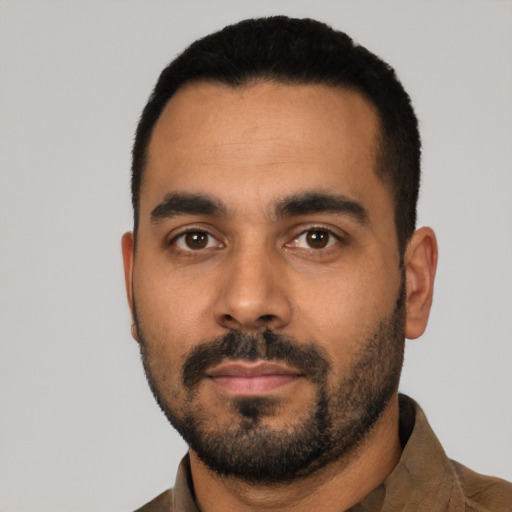 Neutral latino young-adult male with short  black hair and brown eyes