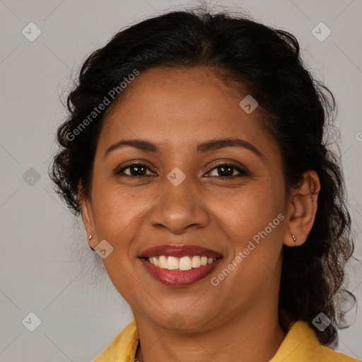 Joyful latino adult female with medium  brown hair and brown eyes