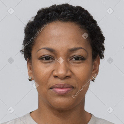 Joyful black adult female with short  brown hair and brown eyes