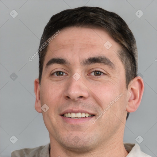 Joyful white young-adult male with short  brown hair and brown eyes