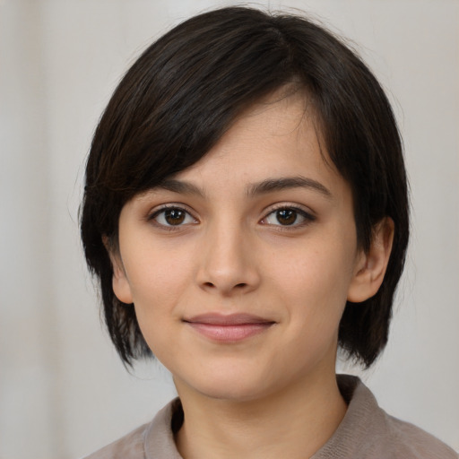Neutral white young-adult female with medium  black hair and brown eyes