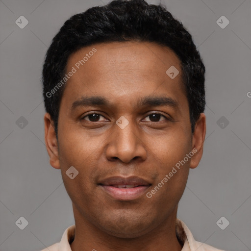 Joyful latino young-adult male with short  black hair and brown eyes