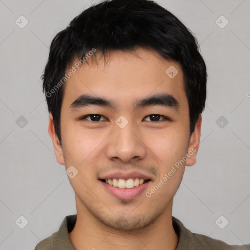 Joyful asian young-adult male with short  black hair and brown eyes