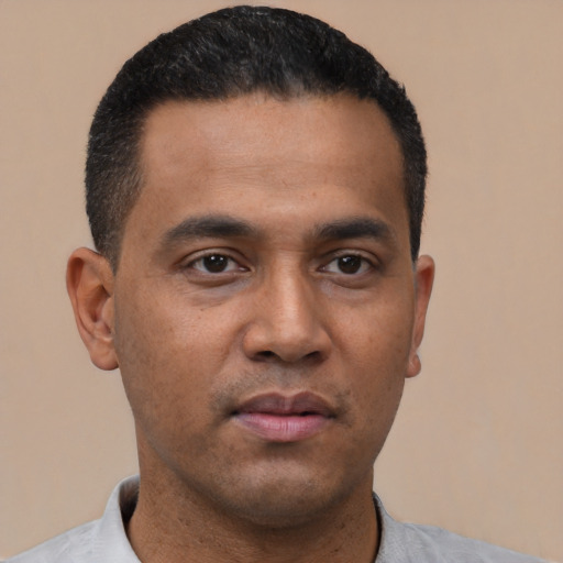 Neutral latino young-adult male with short  black hair and brown eyes