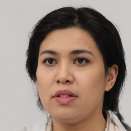 Joyful asian young-adult female with medium  black hair and brown eyes