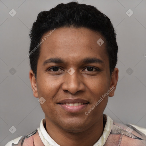 Joyful black young-adult male with short  black hair and brown eyes