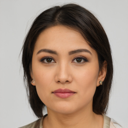 Neutral latino young-adult female with medium  brown hair and brown eyes