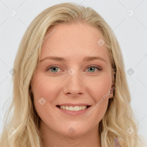 Joyful white young-adult female with long  brown hair and blue eyes