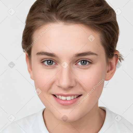 Joyful white young-adult female with short  brown hair and grey eyes