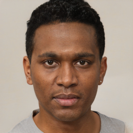 Neutral black young-adult male with short  black hair and brown eyes