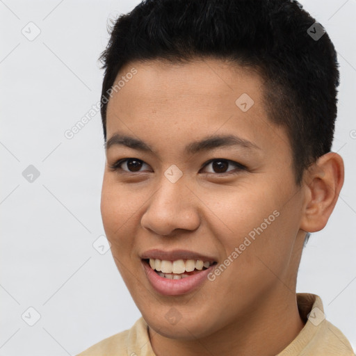 Joyful latino young-adult male with short  brown hair and brown eyes