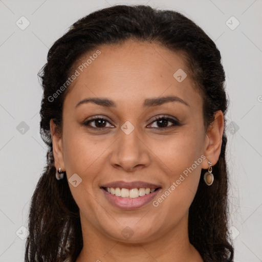 Joyful latino adult female with long  brown hair and brown eyes