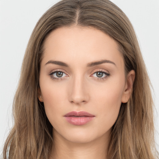 Neutral white young-adult female with long  brown hair and brown eyes