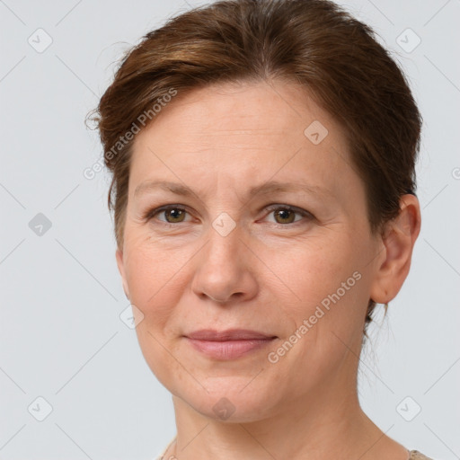 Joyful white adult female with short  brown hair and grey eyes