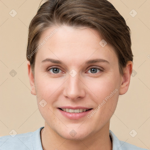 Joyful white young-adult female with short  brown hair and grey eyes