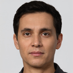 Neutral white young-adult male with short  black hair and brown eyes