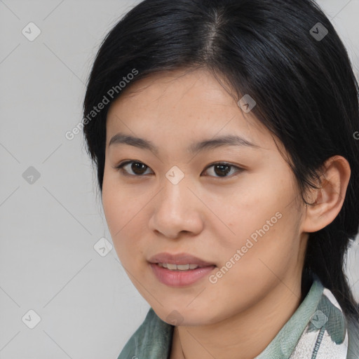 Joyful asian young-adult female with medium  black hair and brown eyes