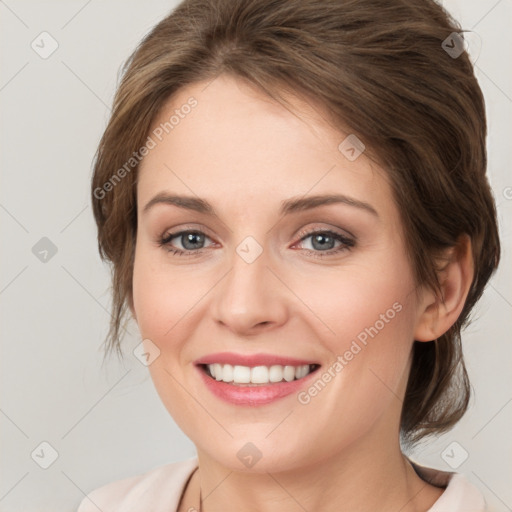 Joyful white young-adult female with medium  brown hair and green eyes