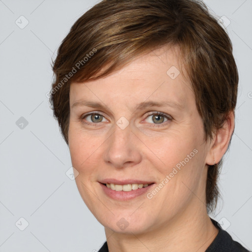 Joyful white adult female with medium  brown hair and grey eyes