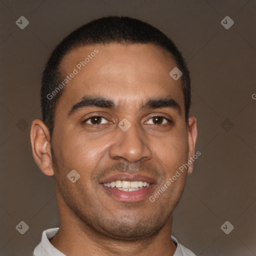 Joyful latino young-adult male with short  brown hair and brown eyes
