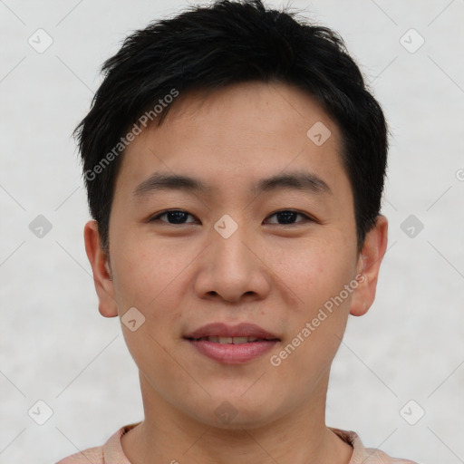 Joyful asian young-adult male with short  brown hair and brown eyes