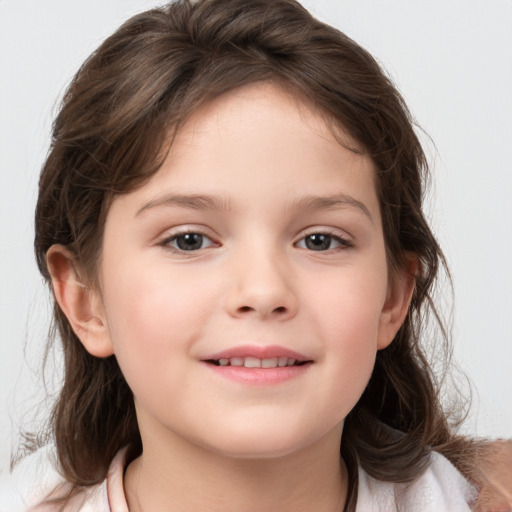 Joyful white child female with medium  brown hair and brown eyes