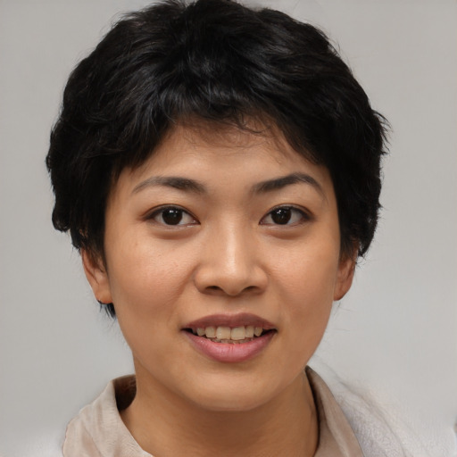 Joyful asian young-adult female with short  brown hair and brown eyes