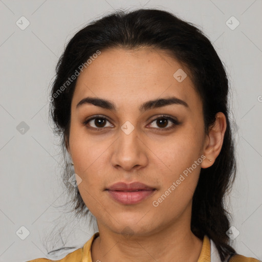 Joyful latino young-adult female with medium  brown hair and brown eyes