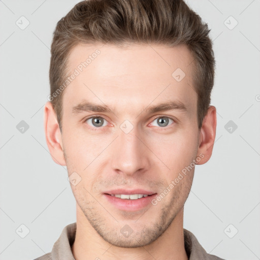 Joyful white young-adult male with short  brown hair and grey eyes