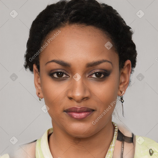 Joyful black young-adult female with short  black hair and brown eyes