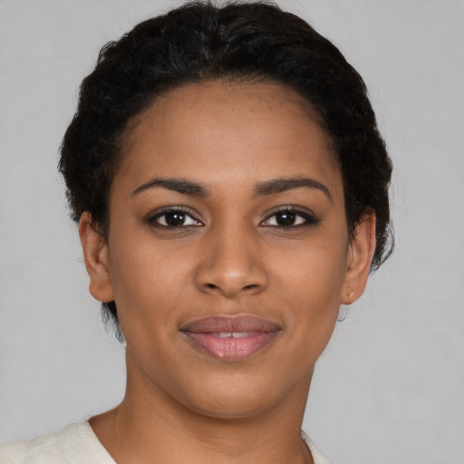 Joyful latino young-adult female with short  brown hair and brown eyes