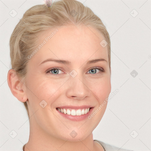 Joyful white young-adult female with short  brown hair and blue eyes