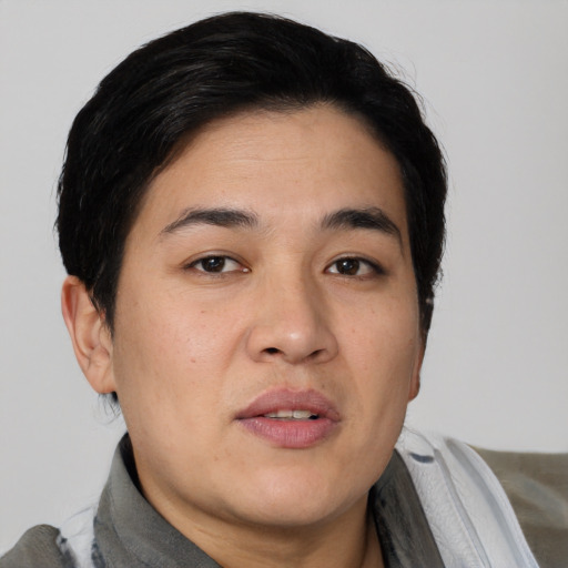 Joyful asian young-adult male with short  black hair and brown eyes