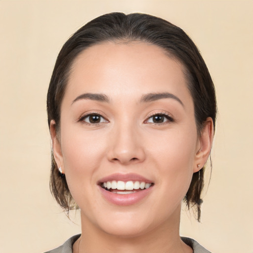 Joyful white young-adult female with medium  brown hair and brown eyes