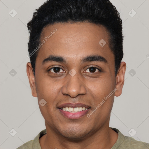 Joyful black young-adult male with short  black hair and brown eyes
