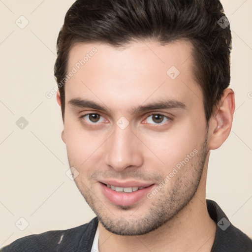 Joyful white young-adult male with short  brown hair and brown eyes