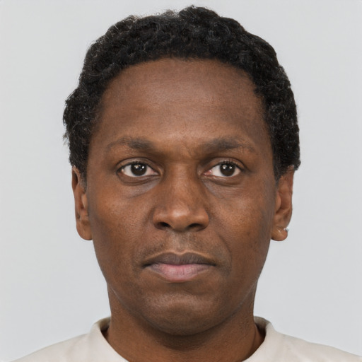 Neutral black adult male with short  brown hair and brown eyes